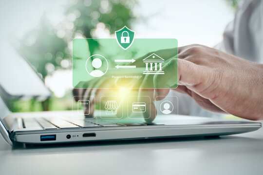 Man typing on laptop with digital secure payment successful interface and online banking transaction icons in outdoor setting, concept of financial technology, cybersecurity, and e-commerce.