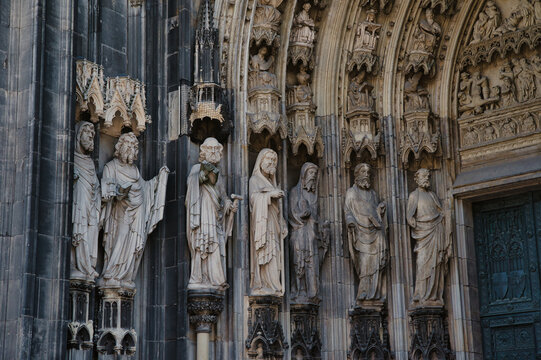 Sculptures located on the jambs or pilasters of the entrance to Cologne Cathedral (K&ouml;lner Dom) in Germany