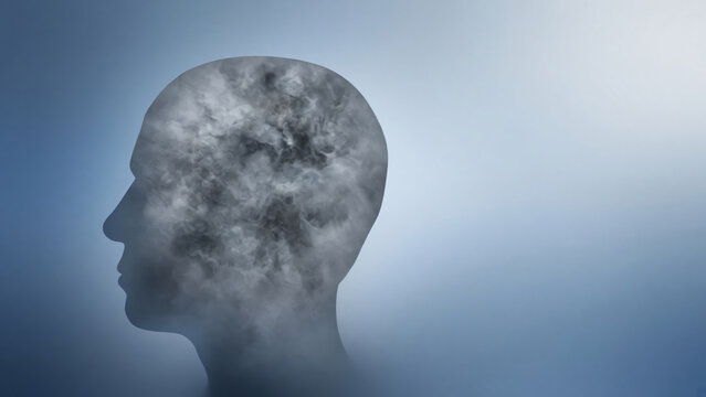 Human head silhouette filled with gray fog on blue background, long covid brain fog concept with copy space