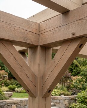 Close-up of wooden pergola beams showing intricate timber joints  