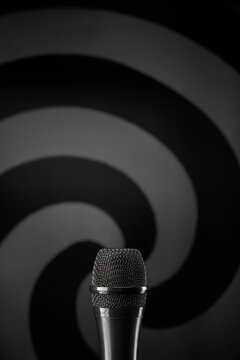 Microphone with hypnotic spiral background concept