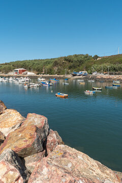 Fishing harbor with colorful boats in Vila Nova de Milfontes