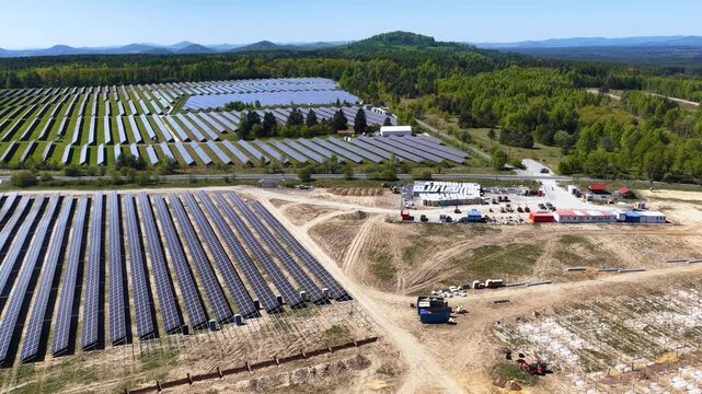 Solar panels generating renewable green energy and electricity in a wide open field, modern clean power technology infrastructure for sustainable energy production, environmental conservation 