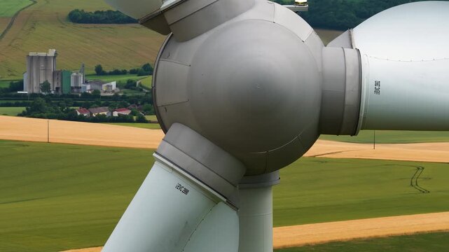 Wind turbines generating renewable green energy and electricity in an open landscape, modern power technology infrastructure for sustainable energy production and clean environmental power systems