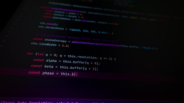 Program script autocompleting algorithm syntax on glowing monitor screen in macro view. Vibe coding workflow offers modern technical visual context for software development edits.