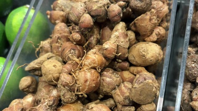 An aromatic herbal concoction made from rice and ginger, served fresh and neatly arranged. Traditional Indonesian spices and seasonings