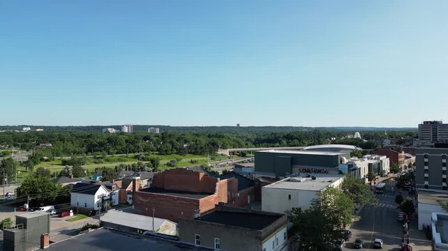 Aerial flying over downtown St. Catharines, Ontario, Canada on a sunny summer afternoon. St. Paul Street, Performing Arts Centre, Burgoyne Bridge and highway 406.