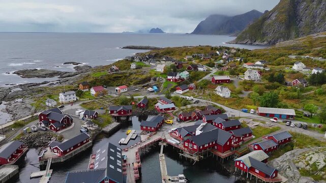 Traditional wooden structures drying skrei cod in Lofoten Islands, Norway, create a captivating scene
