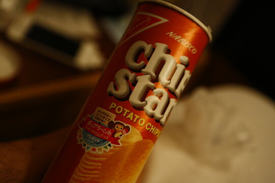 A close-up of a can of Japanese Chip Star potato chips snack.