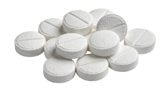 Pile of white round scored tablets, isolated on transparent background