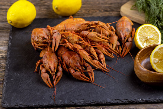 Red boiled crayfish on a dark table background, health food