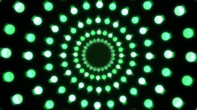 Glowing green neon circle tunnel background featuring radiating matrix light dots animating in concentric rings on dark background for futuristic VJ loop music stage visual motion graphics