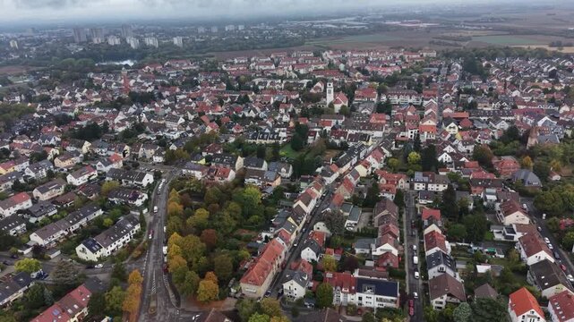 Aerial view above the city beside the old town Wallstadt in Germany beside Mannheim on a sunny noon in autumn.