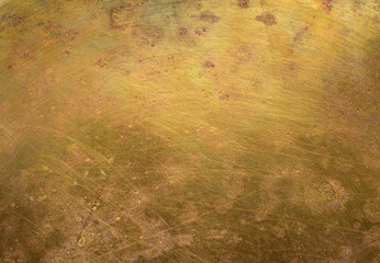 Obraz na płótnie Canvas Close-up of aged brass with rich patina, oxidation, scratches, stains, and traces of time. A painterly metallic surface with intricate textures, weathered details, and warm antique tones.