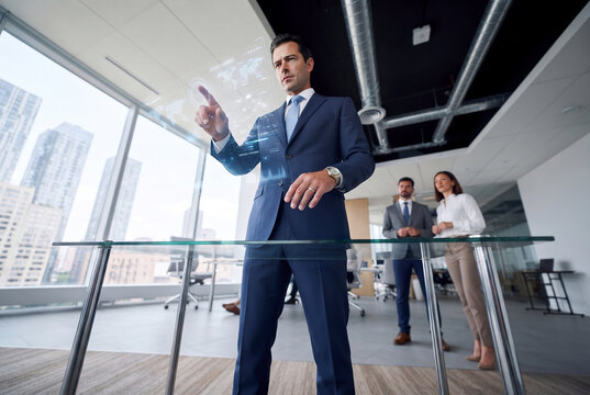 Businessman use virtual interface in modern office