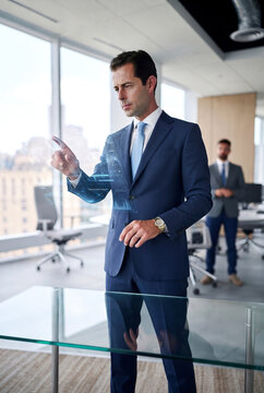 Businessman use holographic interface in modern office