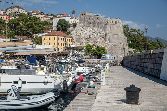HERCEG NOVI, MONTENEGRO&ndash;Sept 1, 2026: The &Scaron;kver harbor and waterfront with marina boats,seaside promenade and historic stone fortresses overlooking the entrance to the Bay of Kotor