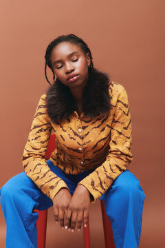 Dreamy Woman Portrait Sit Against Brown Background