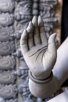 Clay hand of a goddess statue raised in a blessing gesture with a bangle in the Kumartuli district, West Bengal, Kolkata, India