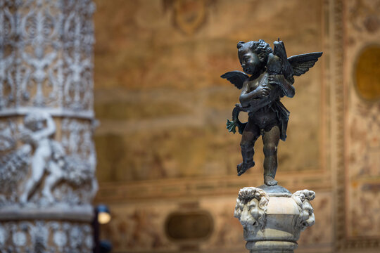 Putto with a Dolphin - bronze sculpture by Andrea del Verrocchio in Palazzo Vecchio, Florence, Italy