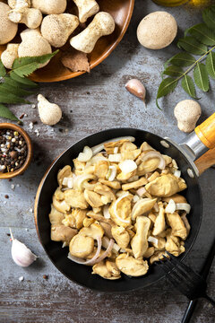 Sauteed mushroom with onion in skillet for seasonal cooking