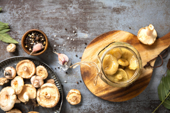 Marinated mushroom jar with fresh mushroom and seasoning