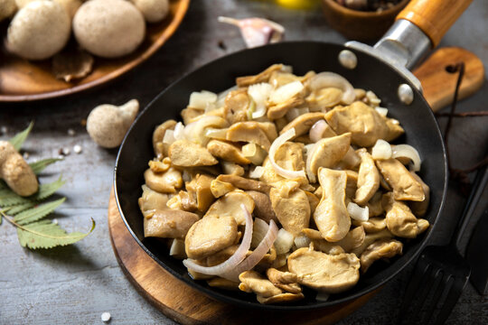 Sauteed wild mushroom with onion in a skillet