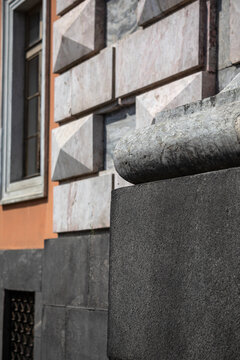 Close up of rusticated stone block wall and granite column base of Saint Michael Castle in Saint Petersburg.