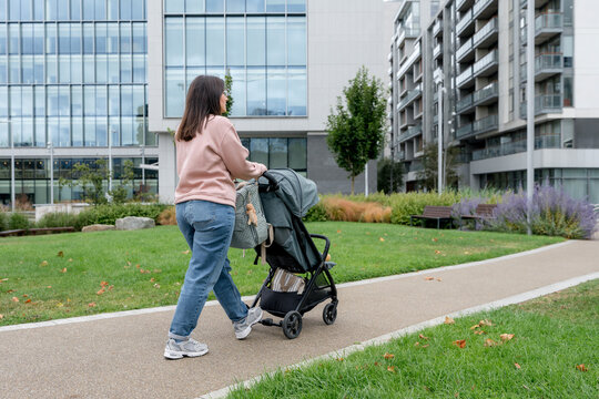 Mother with stroller in Central Park, Dublin
