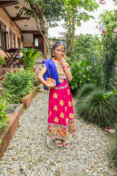 Young Hindu girl in traditional dress at festival ceremony