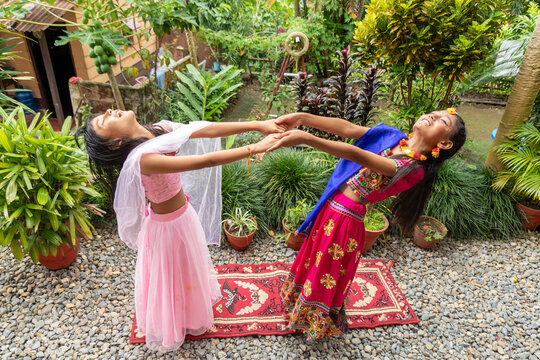Young girls celebrate Hindu festival with traditional dance