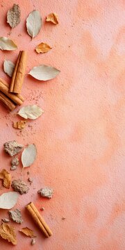 Autumn leaves and cinnamon sticks on textured background for seasonal cooking concepts