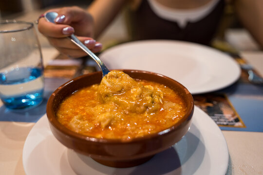 Castilian soup lerma served in traditional earthenware bowl