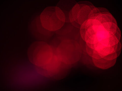 Red bokeh lights abstract background for night celebration