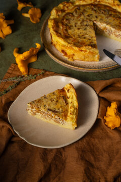 Potato and mushroom quiche slice with chanterelle garnish