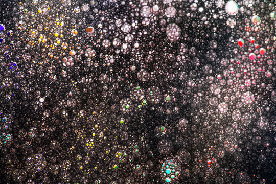 Colorful bubble pattern in dark abstract original art