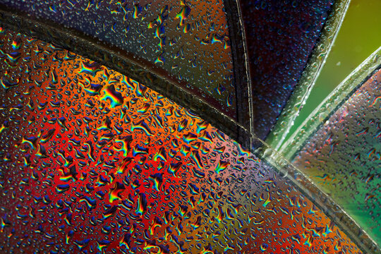 Colorful abstract raindrop texture on stained glass