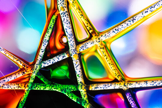 Colorful abstract stained glass pattern with vivid geometric shapes