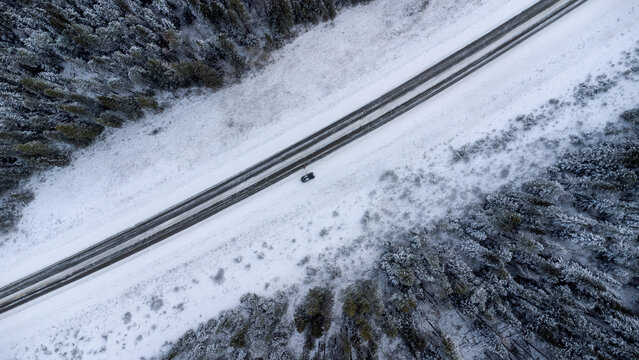 Aerial view of snowy highway near Abraham Lake, Alberta