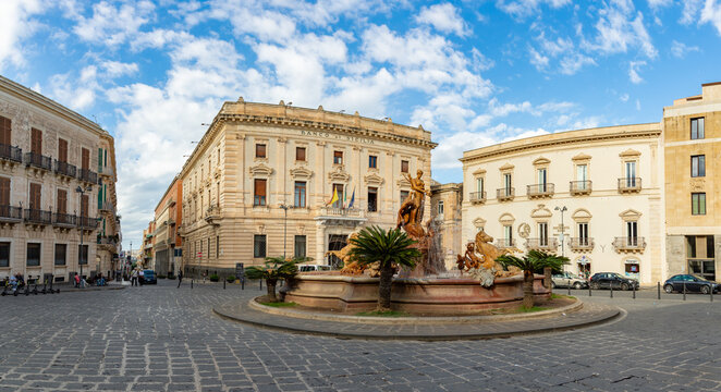 Ortigia, Sicily, Italy - November 5, 2025: A picture of the Piazza Archimede in Ortigia, with the Banco di Sicilia and the Fountain of Diana on display.
