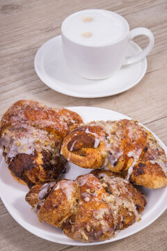 Pastry with poppy seed filing and cup of coffee. Traditional Martin's croissants from polish city Poznan