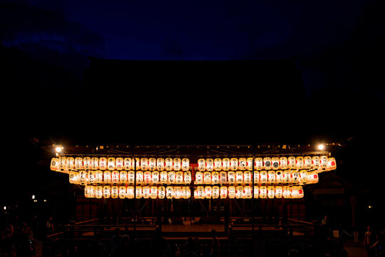 Japanese Shrine Glowing with Paper Lanterns at Night