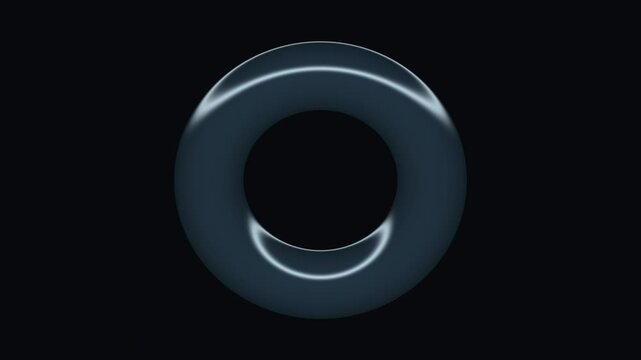 A minimalist three dimensional torus shape with smooth metallic surfaces floating against a deep dark black background for modern abstract