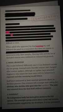 A confidential AI system audit document being redacted to highlight concerns about machine learning training and secrecy.