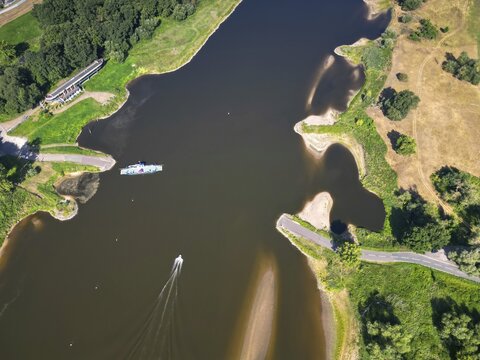 DefaultAerial view, Elbe, yaw ferry, shipping, reed bed, ferry connection, ferry, foggy mood, sunrise, biotope, habitat, motorboat, holiday destination, Germany from above, sandbanks, dryness, low water, drought, climate change, Elbe cycle path, tourism, Elbe floodplains, floodplain landscape, river course, delta, Middle Elbe river landscape, flowing water, sunrise, Middle Elbe biosphere reserve, Saxony-Anhalt, Germany