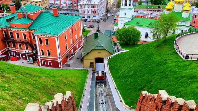 NIZHNY NOVGOROD, RUSSIA - MAY 28, 2026: Funicular and Church of St. John the Baptist. A 17th-century Russian Orthodox landmark perched on National Unity Square beneath the Nizhny Novgorod Kremlin