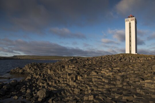 Lighthouse and coastal landscape with basalt formations, K&aacute;lfshamarsv&iacute;k, Skagi Peninsula, Iceland