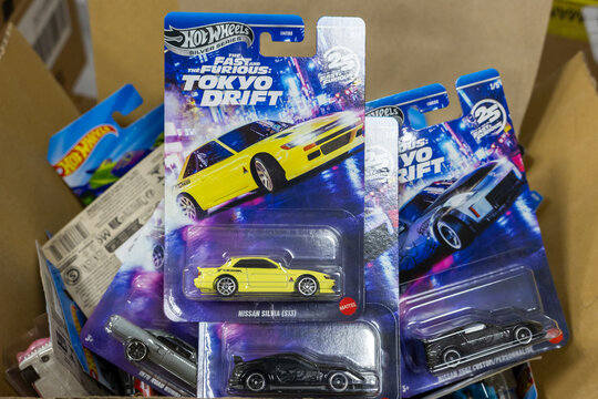 Close up of Hot Wheels Fast and Furious Tokyo Drift diecast toy cars in original packaging, including yellow Nissan Silvia S13, displayed in store. Kaliningrad, Russia. October 7, 2026