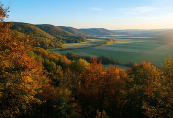 Naklejka premium Autumn landscape with golden forest and valley, seasonal nature scenery with rolling hills and sunlight at sunset for travel and environmental themes