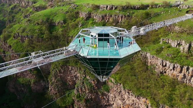 Glass floor bridge over a green gorge, surrounded by steep cliffs, offers an impressive view, aerial view, Diamond Bridge, Diamond Glass Bridge, world's longest free-hanging structure, Dashbashi Gorg